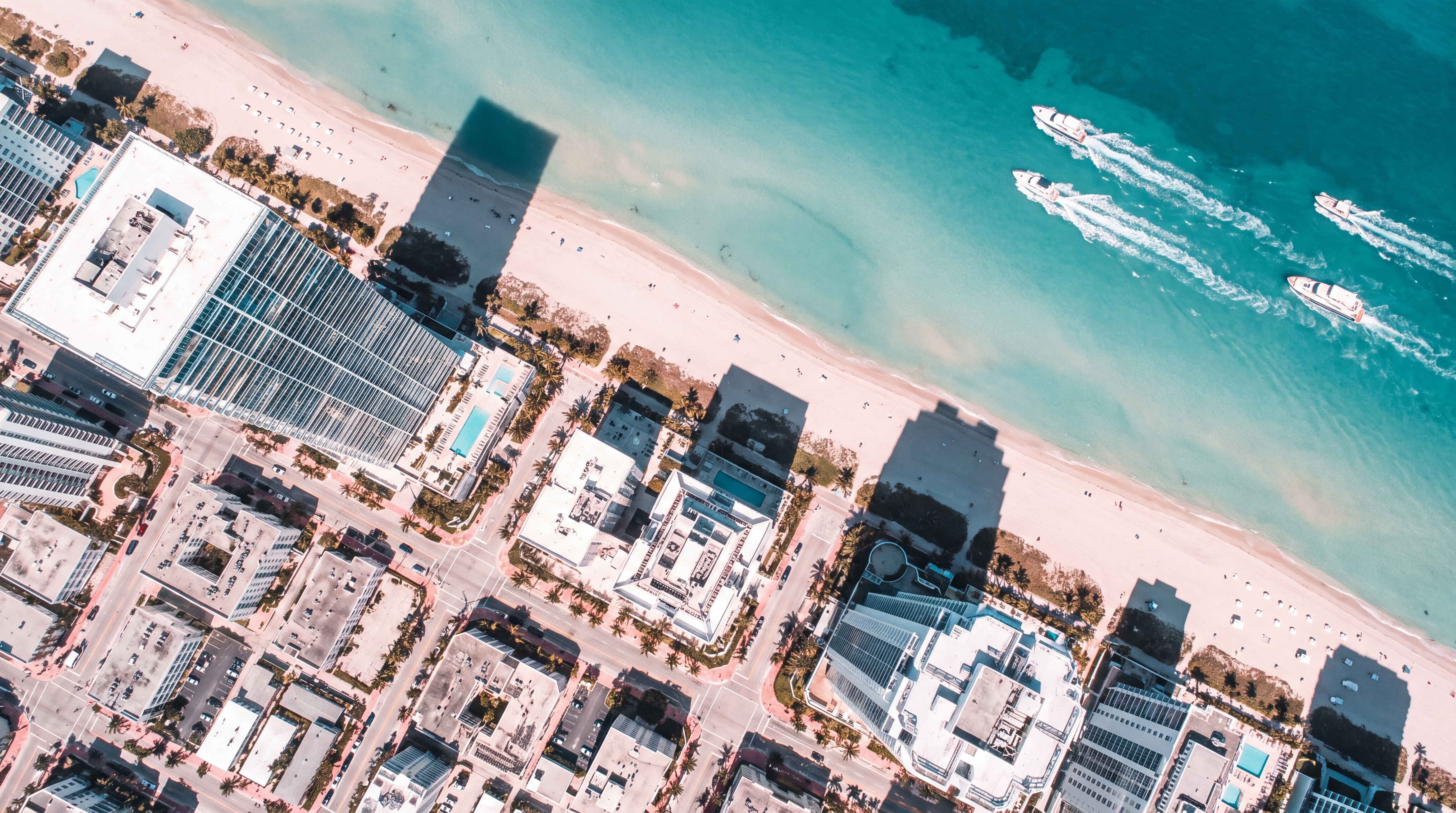 Drone crew capturing an aerial shot over the Miami coastline